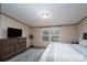 Well-lit bedroom with a comfortable bed, dresser, and a view of the outdoors at 1795 Kestrel Valley Ln, Catawba, NC 28609