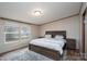 Bright bedroom with a comfortable bed, matching nightstands, and two windows at 1795 Kestrel Valley Ln, Catawba, NC 28609