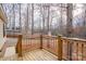 Wooden porch offers views of the surrounding trees and a neighboring home at 1795 Kestrel Valley Ln, Catawba, NC 28609