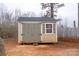 Outdoor shed with double doors and window, providing extra storage space at 1795 Kestrel Valley Ln, Catawba, NC 28609
