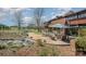 Landscaped backyard with a brick patio and peaceful water feature, ideal for outdoor living at 190 Country Dr, Statesville, NC 28625