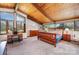 Large bedroom features a wood ceiling, several windows, and a wood dresser with ample lighting at 190 Country Dr, Statesville, NC 28625