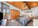 Bright bedroom featuring a vaulted wood ceiling, a window seat, and a spacious closet for ample storage at 190 Country Dr, Statesville, NC 28625