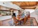 Bright dining room with wood floors, wood ceilings, views to the backyard and access to the living room at 190 Country Dr, Statesville, NC 28625