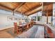 Bright dining room with wood floors, wood ceilings, views to the backyard and access to the living room at 190 Country Dr, Statesville, NC 28625