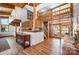 Bright foyer with wood floors, high ceilings, wood staircase, and view to the backyard through the living room at 190 Country Dr, Statesville, NC 28625