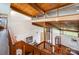 Open foyer features wood stairs with a loft style overlooking the front entrance with natural light at 190 Country Dr, Statesville, NC 28625