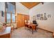 Home office with vaulted wood ceilings, built in shelving, a large window, and a closet for added storage at 190 Country Dr, Statesville, NC 28625