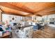 Open kitchen features wood ceiling, blue island with bar seating, and stainless steel appliances at 190 Country Dr, Statesville, NC 28625