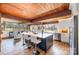 Spacious kitchen with a large blue island, white countertops, and wood-paneled ceiling at 190 Country Dr, Statesville, NC 28625