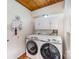 Laundry room with a washer and dryer, white cabinets, and a stylish decor for a modern touch at 190 Country Dr, Statesville, NC 28625