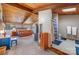 Open-concept main bedroom with a unique bathroom featuring white tile floors, a shower, and a wood paneled ceiling at 190 Country Dr, Statesville, NC 28625