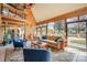 Bright sunroom with wood paneling, a ceiling fan, tile floors and an abundance of natural light at 190 Country Dr, Statesville, NC 28625