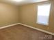 Standard bedroom with carpet, neutral paint, and window for natural light at 1909 E Lawyers Rd, Monroe, NC 28110