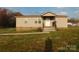 Charming single story home featuring a small porch, traditional windows, and vinyl siding at 1909 E Lawyers Rd, Monroe, NC 28110