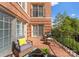 Brick balcony complete with comfortable seating at 2445 Selwyn Ave, Charlotte, NC 28209
