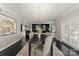 Formal dining room with dark wood table, contemporary lighting, and stylish decor at 2445 Selwyn Ave, Charlotte, NC 28209