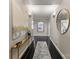 Elegant hallway featuring dark wood floors, stylish decor, and tasteful lighting creating a welcoming ambiance at 2445 Selwyn Ave, Charlotte, NC 28209