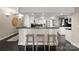 Modern kitchen with a breakfast bar, stainless steel appliances, and custom cabinetry at 2445 Selwyn Ave, Charlotte, NC 28209