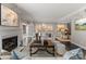Bright living room with a fireplace, neutral furniture, and elegant decor providing a cozy and sophisticated setting at 2445 Selwyn Ave, Charlotte, NC 28209