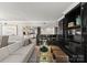 Stylish living room with custom built-ins, lots of seating, and a view into the kitchen at 2445 Selwyn Ave, Charlotte, NC 28209