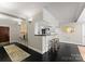 Open-concept space with bar, dark wood floors, and modern decor providing a chic and inviting atmosphere at 2445 Selwyn Ave, Charlotte, NC 28209