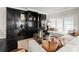 Comfortable living room with custom shelving and large windows at 2445 Selwyn Ave, Charlotte, NC 28209