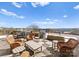 Spacious rooftop deck featuring outdoor seating, a grill, planters, and views of the city skyline at 2445 Selwyn Ave, Charlotte, NC 28209