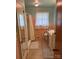 Bathroom with shower, toilet, vanity, and good natural light at 2730 Medlin Rd, Monroe, NC 28112