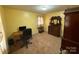 Bedroom featuring a vintage wood dresser, desk, chair, and natural light at 2730 Medlin Rd, Monroe, NC 28112