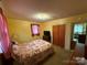 Comfortable bedroom with closet space, window, and decorative bedding at 2730 Medlin Rd, Monroe, NC 28112