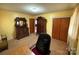 Bedroom featuring a vintage wood dresser, desk, chair, and natural light at 2730 Medlin Rd, Monroe, NC 28112