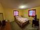 Cozy bedroom with neutral carpet, natural light and simple furnishings at 2730 Medlin Rd, Monroe, NC 28112