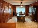 Cozy wood paneled dining room with traditional furnishings and natural light at 2730 Medlin Rd, Monroe, NC 28112