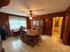 Traditional dining room with wood paneling and a large window at 2730 Medlin Rd, Monroe, NC 28112