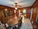 Spacious dining area with wood paneling and classic furnishings at 2730 Medlin Rd, Monroe, NC 28112