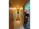 Long hallway connecting rooms, featuring carpet runner and paneling at 2730 Medlin Rd, Monroe, NC 28112