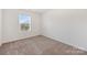 Cozy bedroom with carpet flooring and natural light from a window at 2749 Yeager Nw Dr, Concord, NC 28027