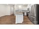 Stylish kitchen with white cabinetry, granite countertops, and stainless steel appliances at 2749 Yeager Nw Dr, Concord, NC 28027