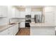 Modern kitchen features stainless steel appliances, granite countertops, and ample cabinet space at 2749 Yeager Nw Dr, Concord, NC 28027