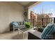 Inviting balcony showcasing a stylish seating arrangement with picturesque views of the surrounding community at 300 W 5Th St # 224, Charlotte, NC 28202