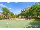 Community putting green with fountain and seating, perfect for relaxing and enjoying the outdoors at 300 W 5Th St # 224, Charlotte, NC 28202