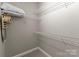 Walk-in closet boasting wire shelving, ample storage space, and neutral paint for organizing essentials at 300 W 5Th St # 224, Charlotte, NC 28202