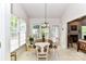 Cozy breakfast nook features a round table, large windows, and an open doorway to a living space at 306 Ashby Dr, Davidson, NC 28036