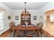 Elegant dining room with a wooden table, chairs, and hutch, perfect for Gathering meals at 306 Ashby Dr, Davidson, NC 28036