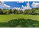 Expansive community field, soccer goals, and a gazebo under a bright, partly cloudy sky at 306 Ashby Dr, Davidson, NC 28036