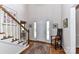 Bright foyer with hardwood floors, staircase, and a welcoming atmosphere at 306 Ashby Dr, Davidson, NC 28036