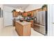 Bright kitchen featuring stainless steel appliances, an island, and ample cabinet space at 306 Ashby Dr, Davidson, NC 28036
