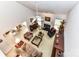 Bright living room with a fireplace, piano, neutral decor, and view of the kitchen/dining area at 306 Ashby Dr, Davidson, NC 28036