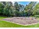 Community playground with swings, climbing structures and seating area for Gathering fun at 306 Ashby Dr, Davidson, NC 28036